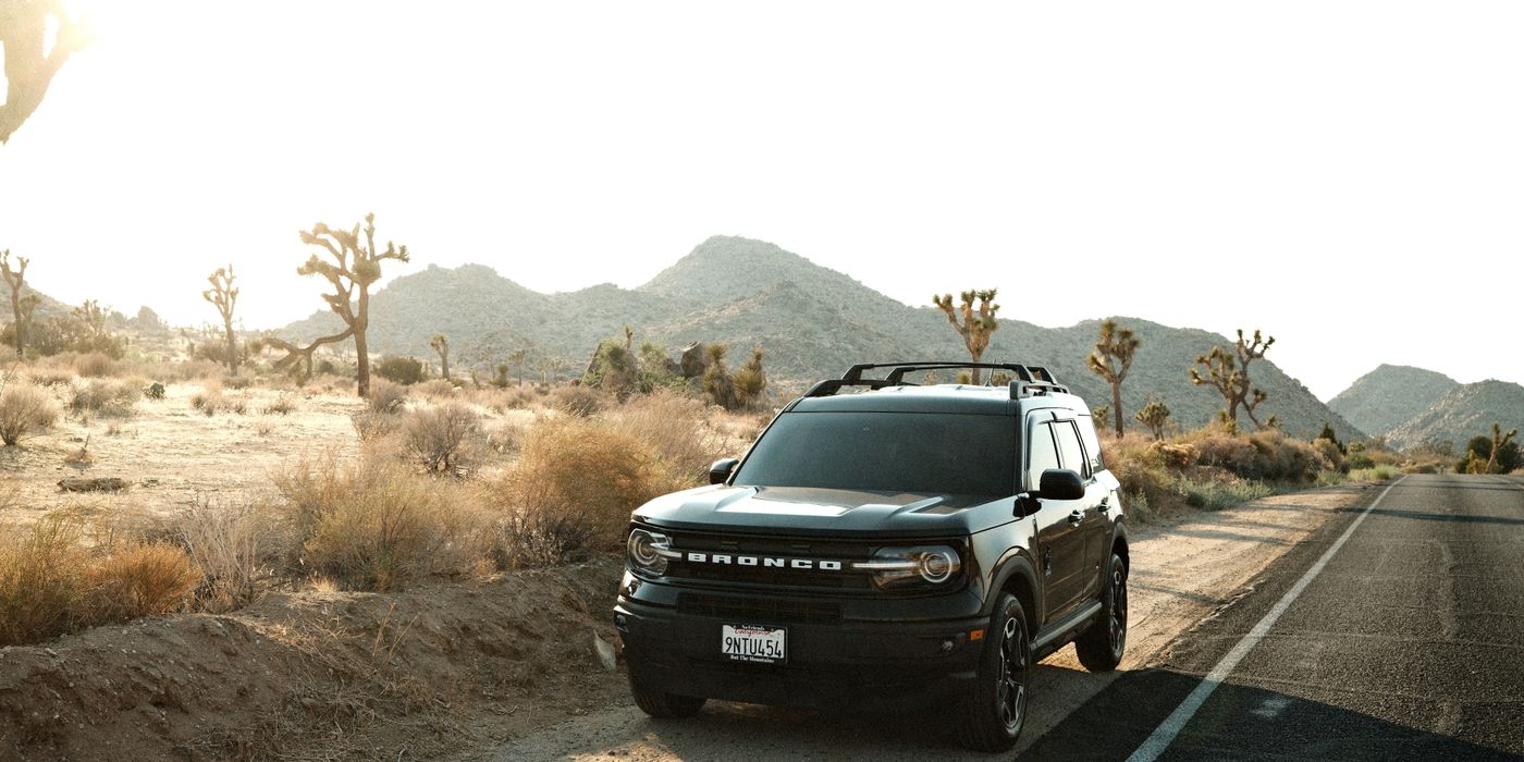SUV on a desert road in Joshua Tree, California