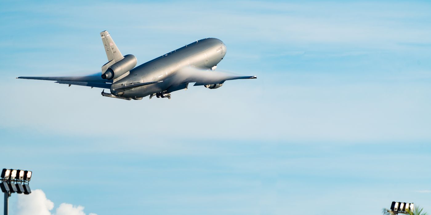 Airplane taking off into a blue sky