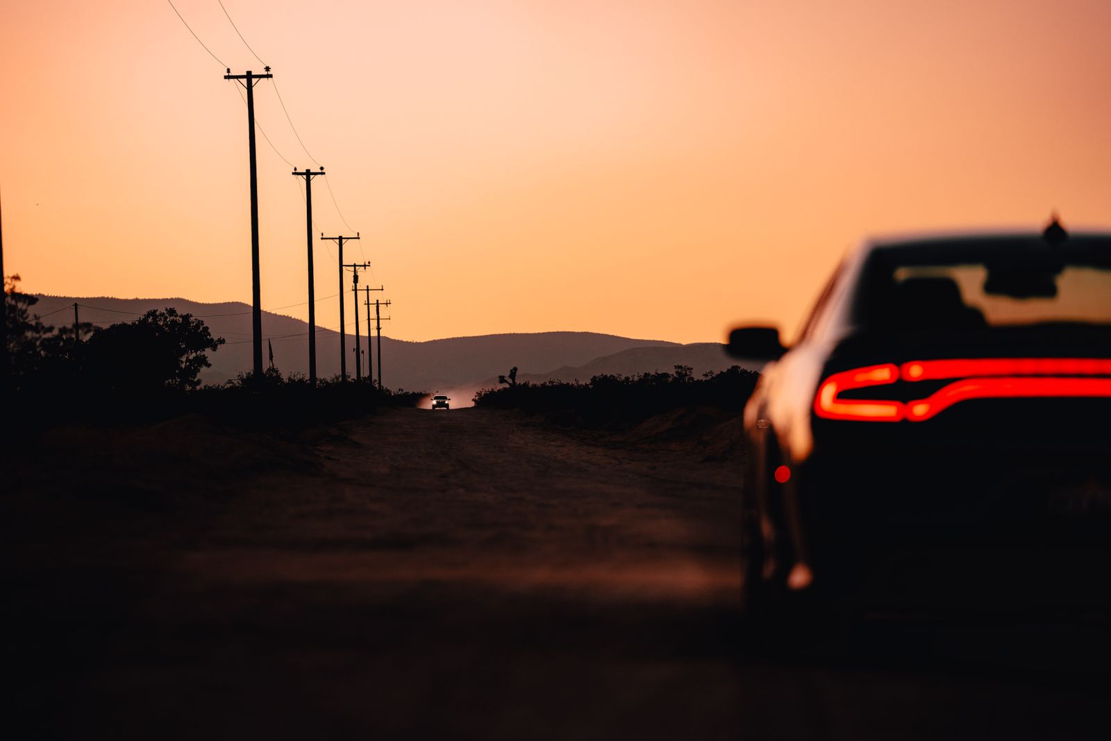 Car on the road at sunset