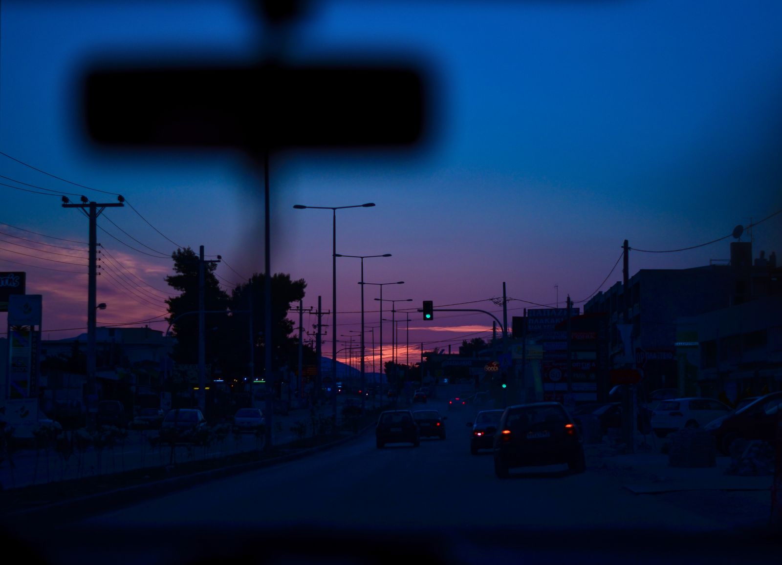 Car on the road at sunset